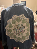 Beautiful upcycled denim jacket with quilted medallion on back. Size XL